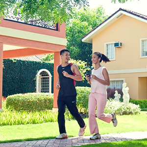 guy and girl jogging on camella homes batangas jogging path